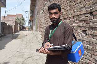 Polio worker in field